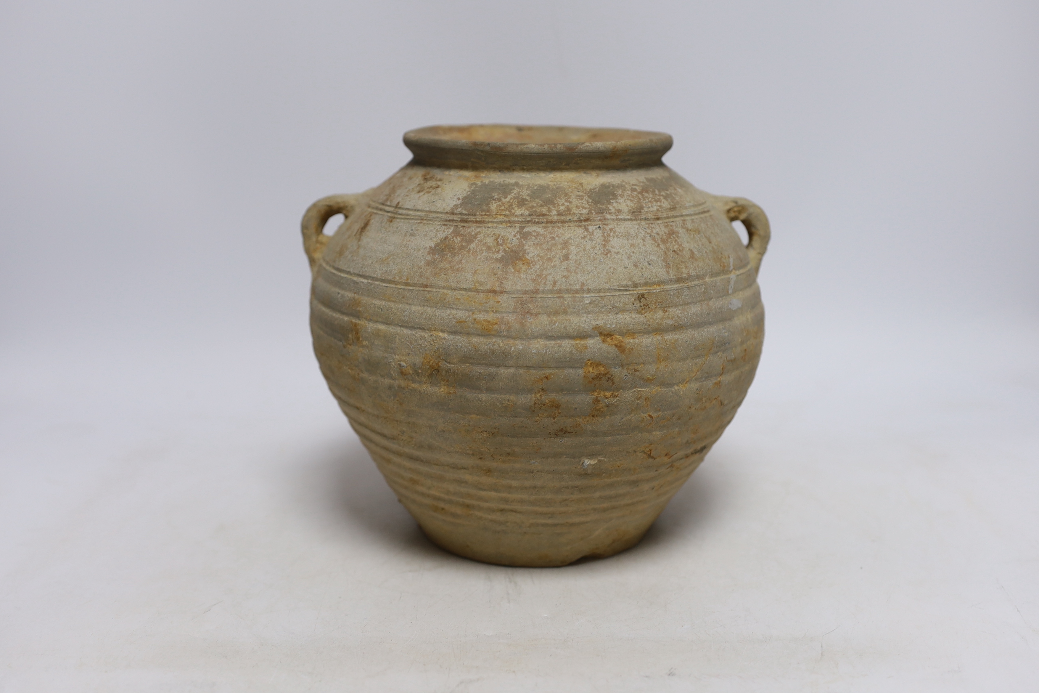 A Chinese grey pottery jar, Han dynasty, 19cm high